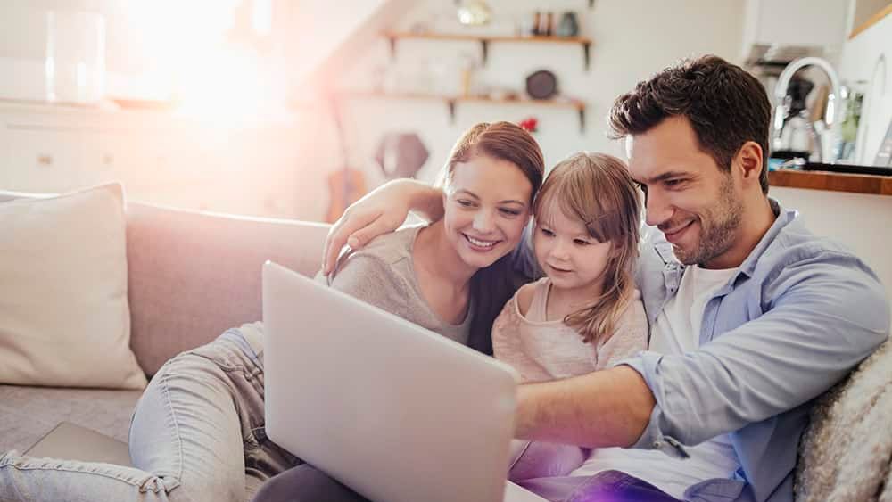A family reviewing mortgage options together at a laptop